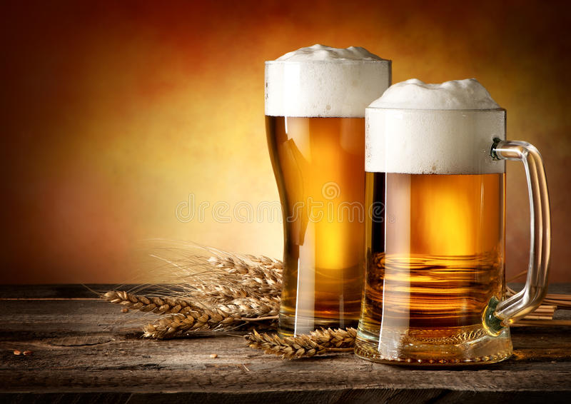 two-mugs-beer-wheat-wooden-table-52155843.jpg